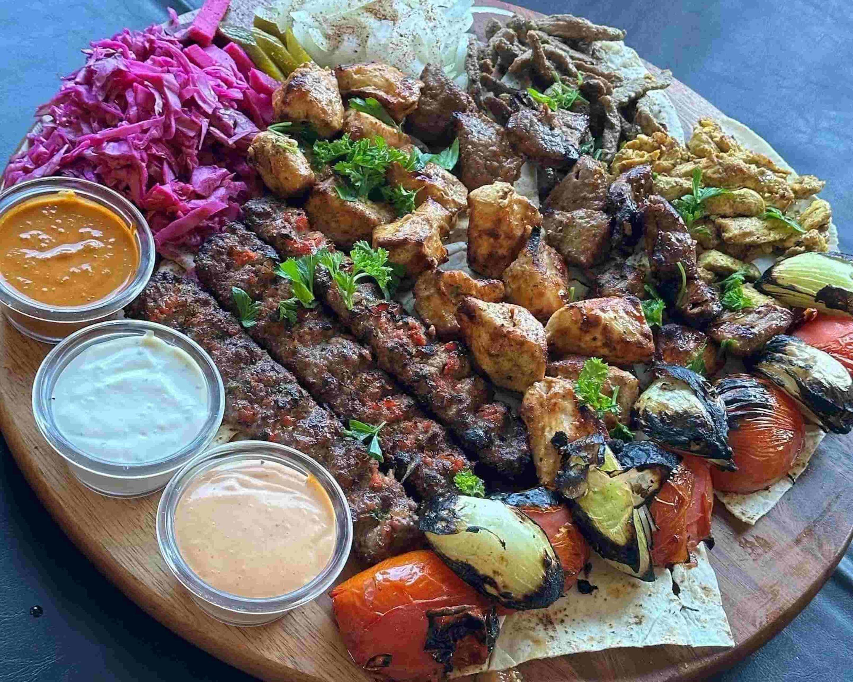 Pasha Cafe signature dishes Chicken Shawarma Wrap
Slemani Tray One
Pasha Mixed Grill Plate